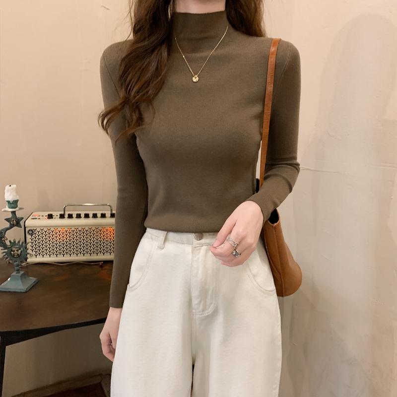 Nuevo invierno ajustado tejido de punto Color sólido cuello redondo señoras moda camisa por el trasero suéter mujer ropa