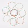 Böhmisches mehrlagiges elastisches Armband-Set: 8 Stränge kreativer Reiskornschmuck