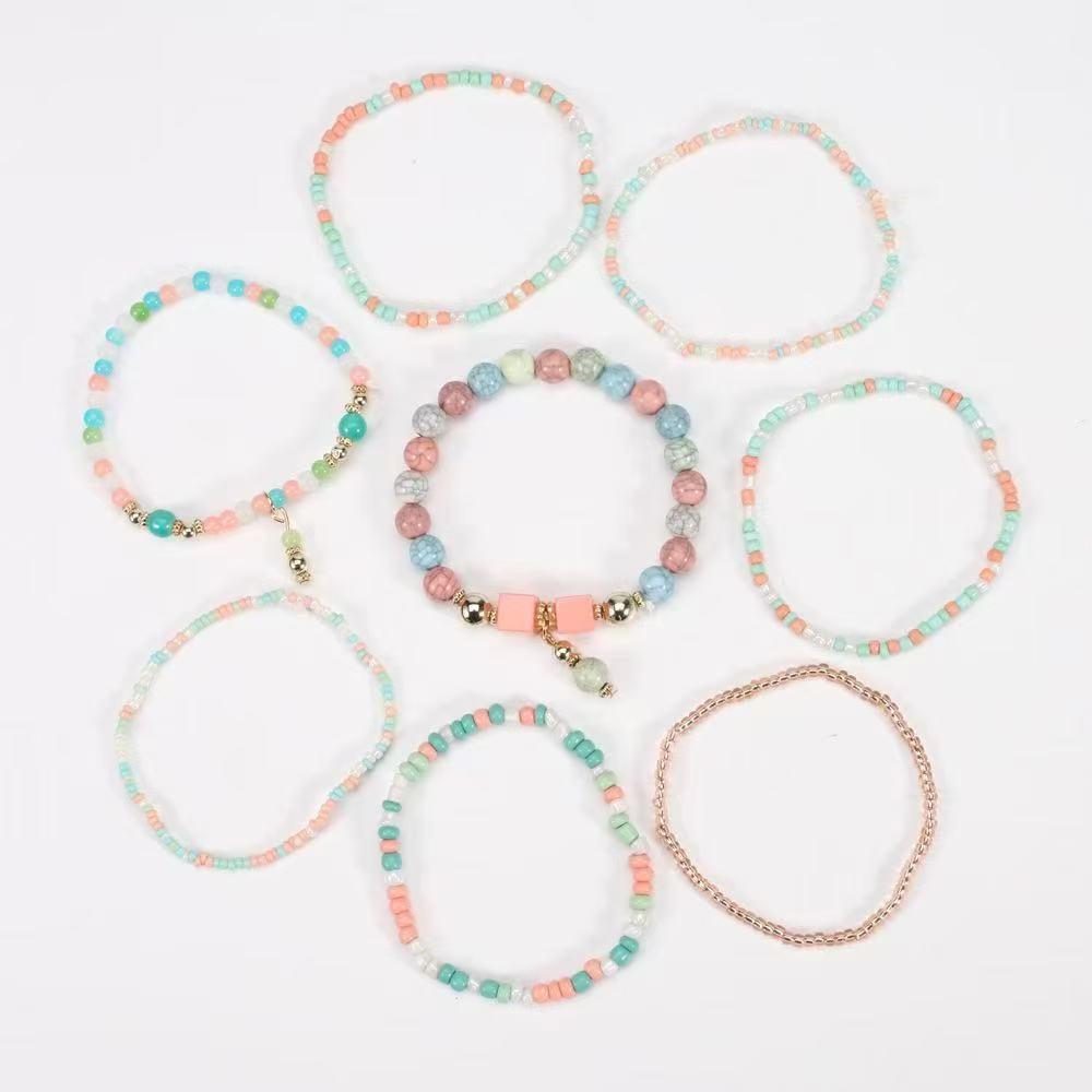 Böhmisches mehrlagiges elastisches Armband-Set: 8 Stränge kreativer Reiskornschmuck