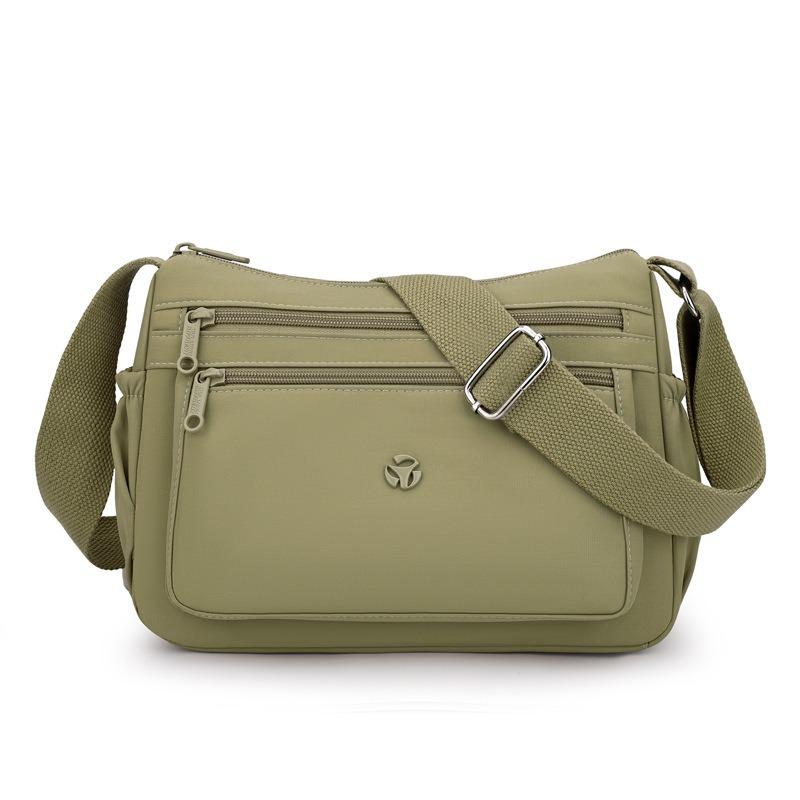 

New multi-compartment messenger bag medium old mother bag light large capacity nylon bag play commuter shoulder bag сосна зелений колір