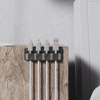 Magnetic Desktop Cable Organizer: Self-Adhesive Holder for Mobile Charging Cables.