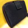 Used Excellent condition PRADA dry plum color bi-fold wallet with triangle logo plate and zipper