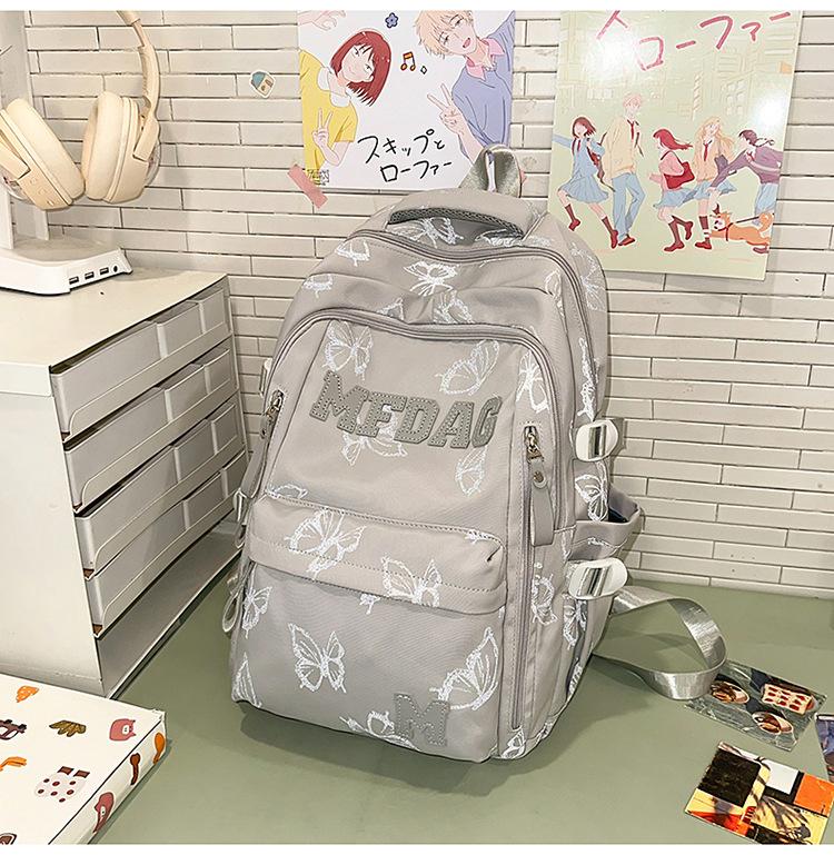Schoolbag Soft light Cool atmosphere Milk white butterfly full print schoolbag Junior high school students Daily commute Lightweight versatile