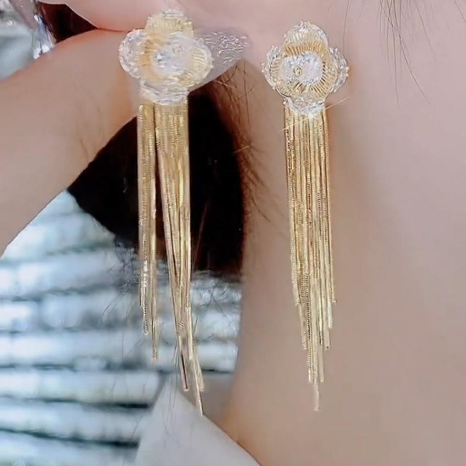 

Gold-Tone Rhinestone Four-Leaf Flower Tassel Earrings: Trendy Japanese and Korean Style Drop Earrings for Women.