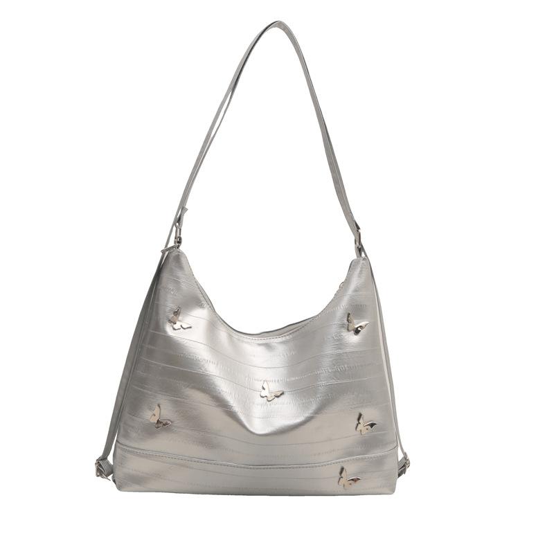 

Popular large-capacity hardware butterfly backpack women s 2024 new fashion trend texture commuter messenger shoulder bag срібний