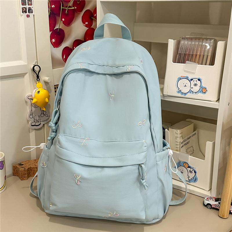 Zaino scolastico carino con ricamo a fiocco, tasca frontale, manico superiore, zainetto casual per uso quotidiano