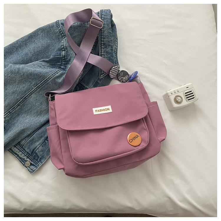 

Spring new nylon big bag, student class shoulder messenger bag fashionable simple cute satchel bag розовый