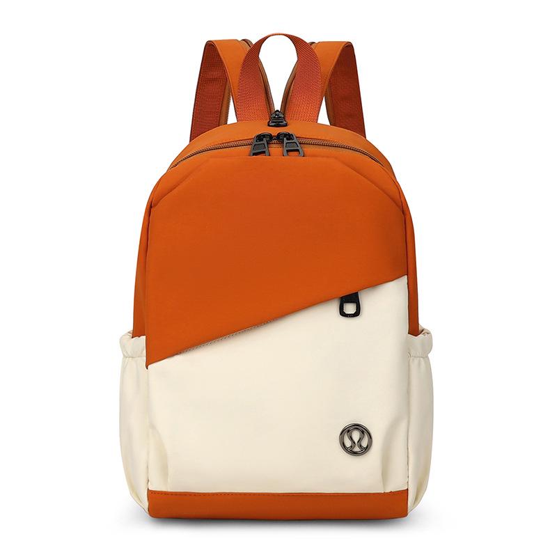 

Трендовая женская нейлоновая сумка-тоут и рюкзак 2025 года с дизайном цветного блока и декоративной строчкой оранжевый