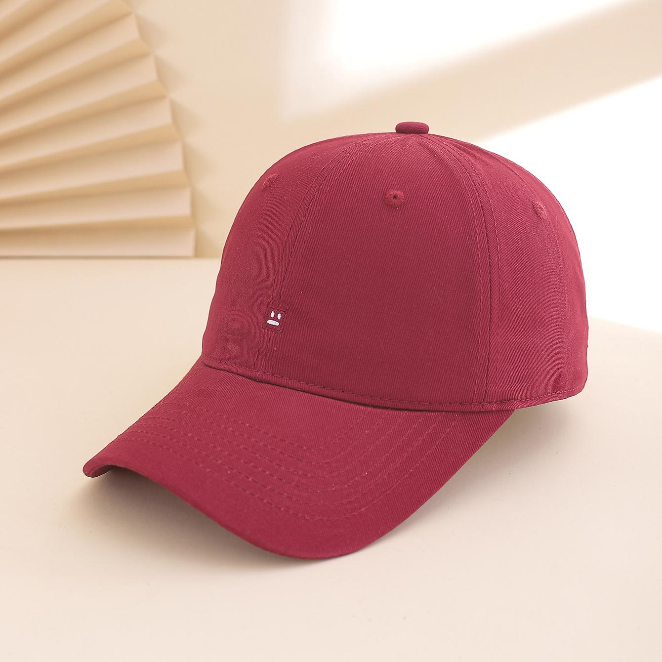 

A solid-color embroidered smiling face adjustable, simple and versatile baseball cap for daily home leisure and entertainment One Size бордовий