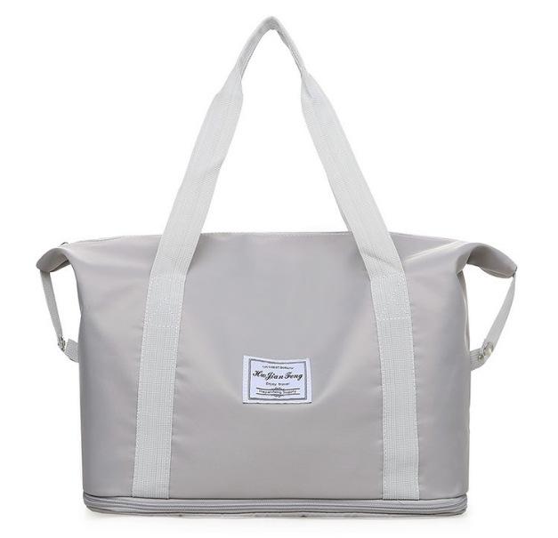 Women's Large Capacity Foldable Travel Bag with Wheels and Telescopic Handle