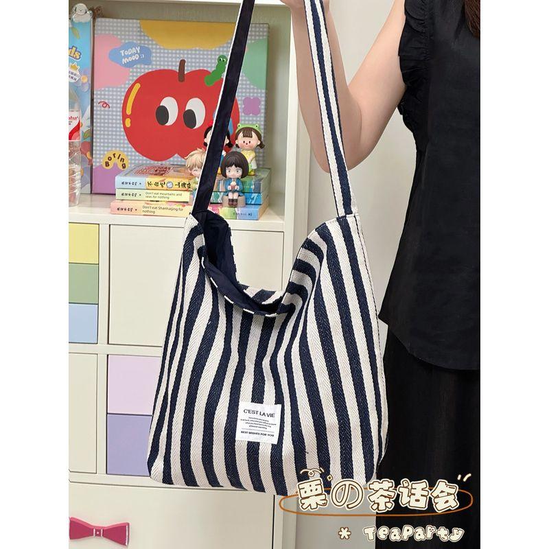 

Stripes Large Capacity Bag Female 2025 New Arrival Ins Style Red Shoulder Bag Commuter Tote Casual Canvas Bag Navy blue double-sided back
