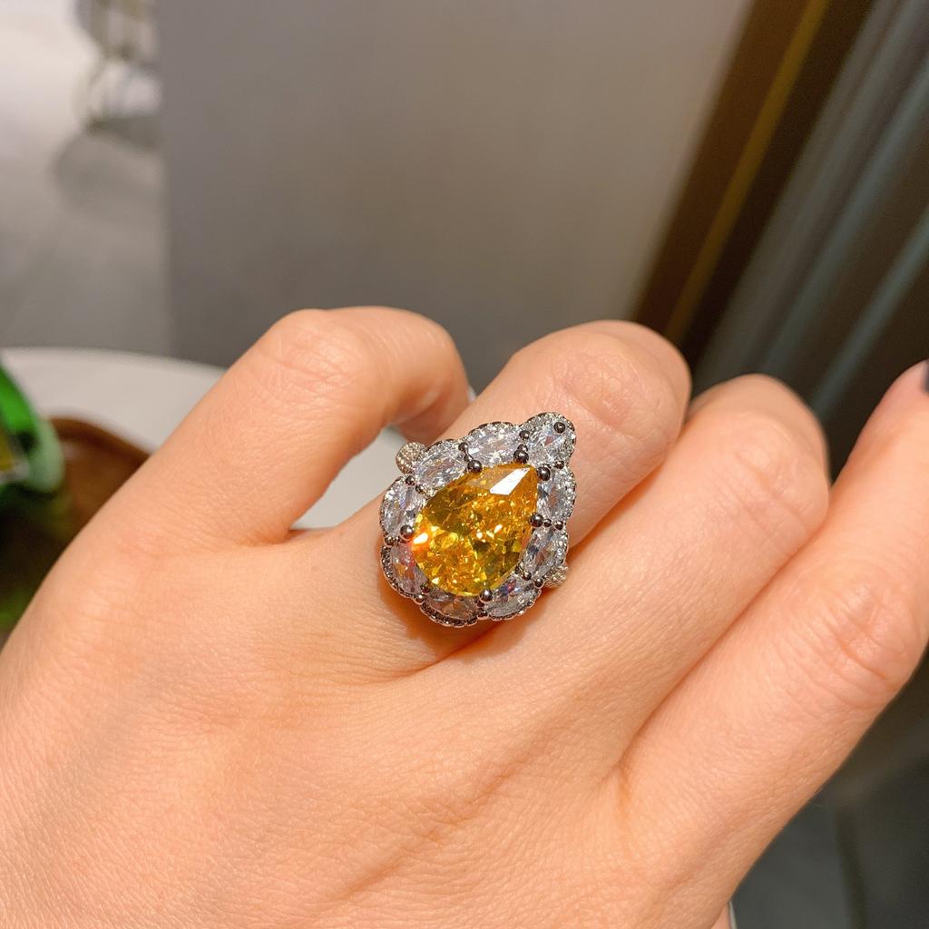 Wish European and American style retro simulation powder Huangbao water drop ring main stone 10 * 14