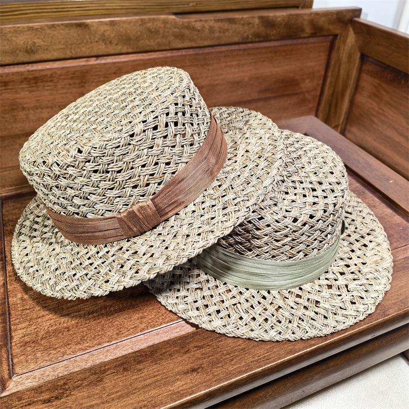 High sense handmade salty grass hollow woven straw hat women's French summer fashion beach hat British flat top hat tide