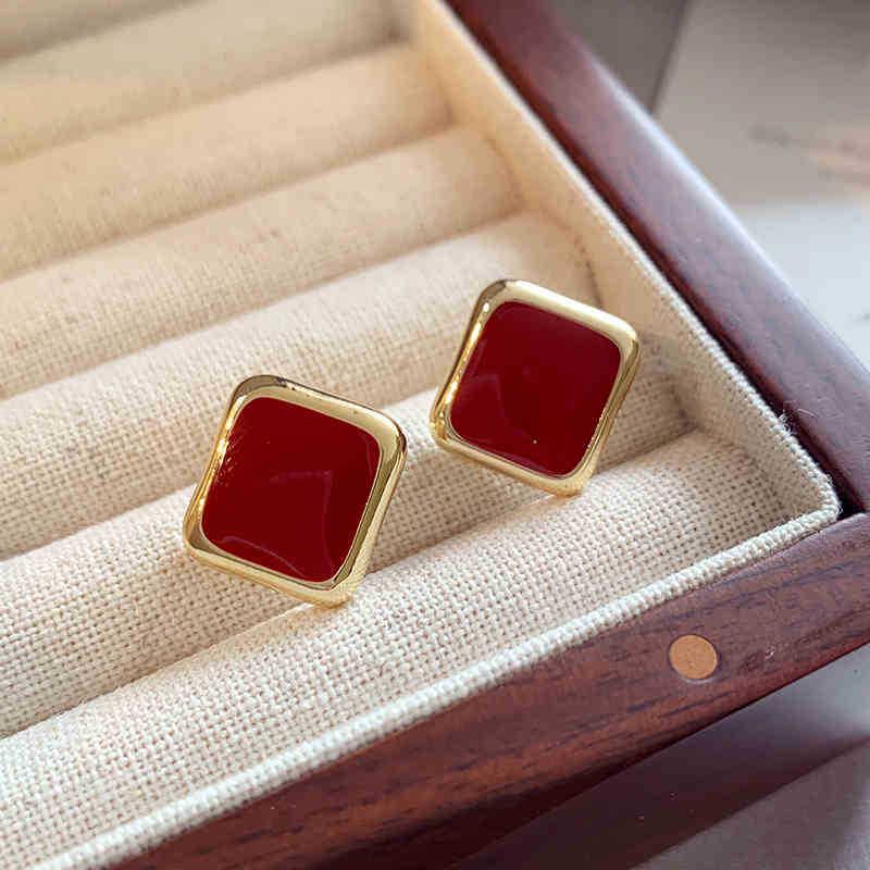 

Срібні сережки-пусети у вигляді ретро геометричного серця на осінь/зиму - Розкішний дизайн з червоною намистиною для жінок