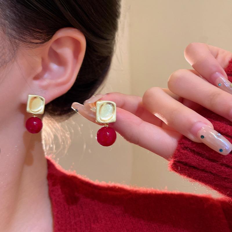 Elegant red pearl earrings women s light luxury niche stud earrings simple temperament earrings