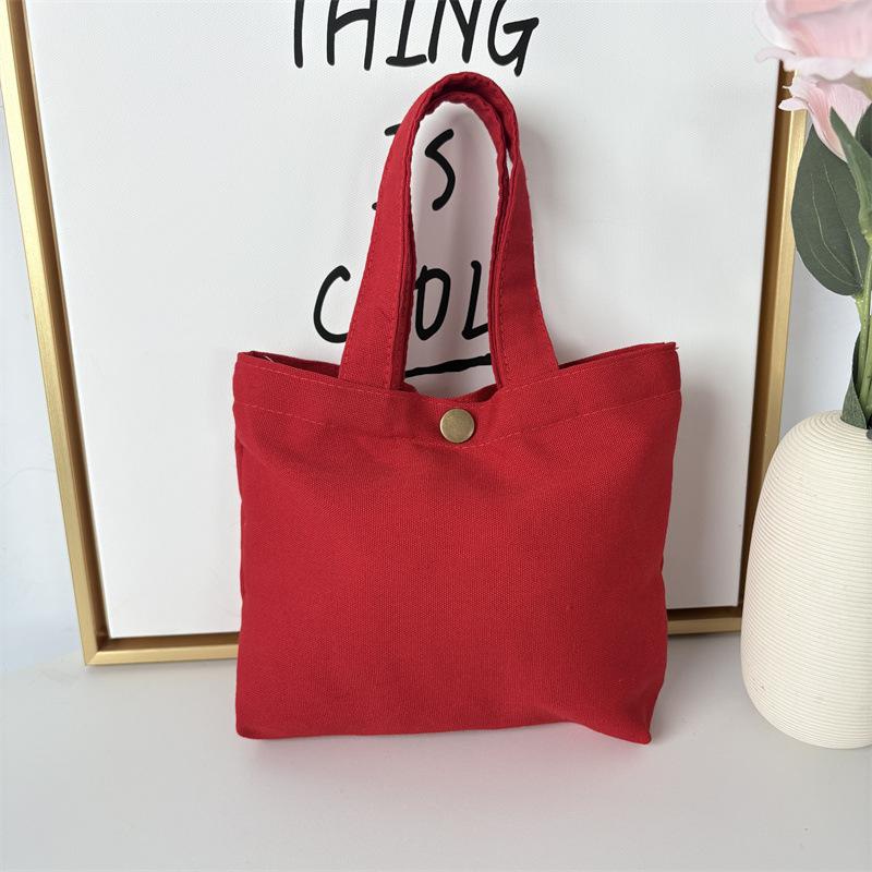 Effenkleurige eenvoudige lunchtas, draagbare canvas tas, kleine stoffen tas, draagbare canvas tas voor het opbergen van diverse spullen