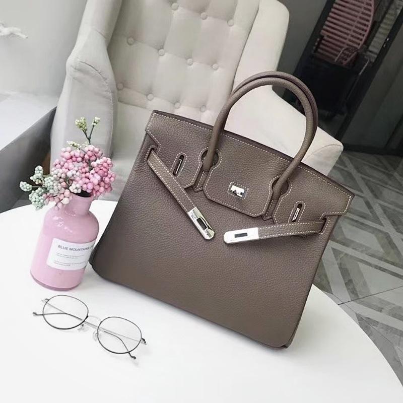 Mode erste Schicht Rindsleder Togo Platin Tasche Damen Silberne Schnalle High-End Handtasche Vielseitige Schulter Umhängetasche