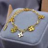 Fashionable Gold Hollowed Out Clover Tassel Titanium Steel Bracelet