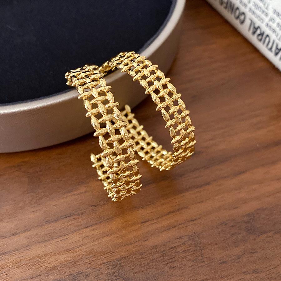 

K real gold electroplated silver needle metal wide-sided hollow earrings individual cold wind earrings light luxury high-end earrings