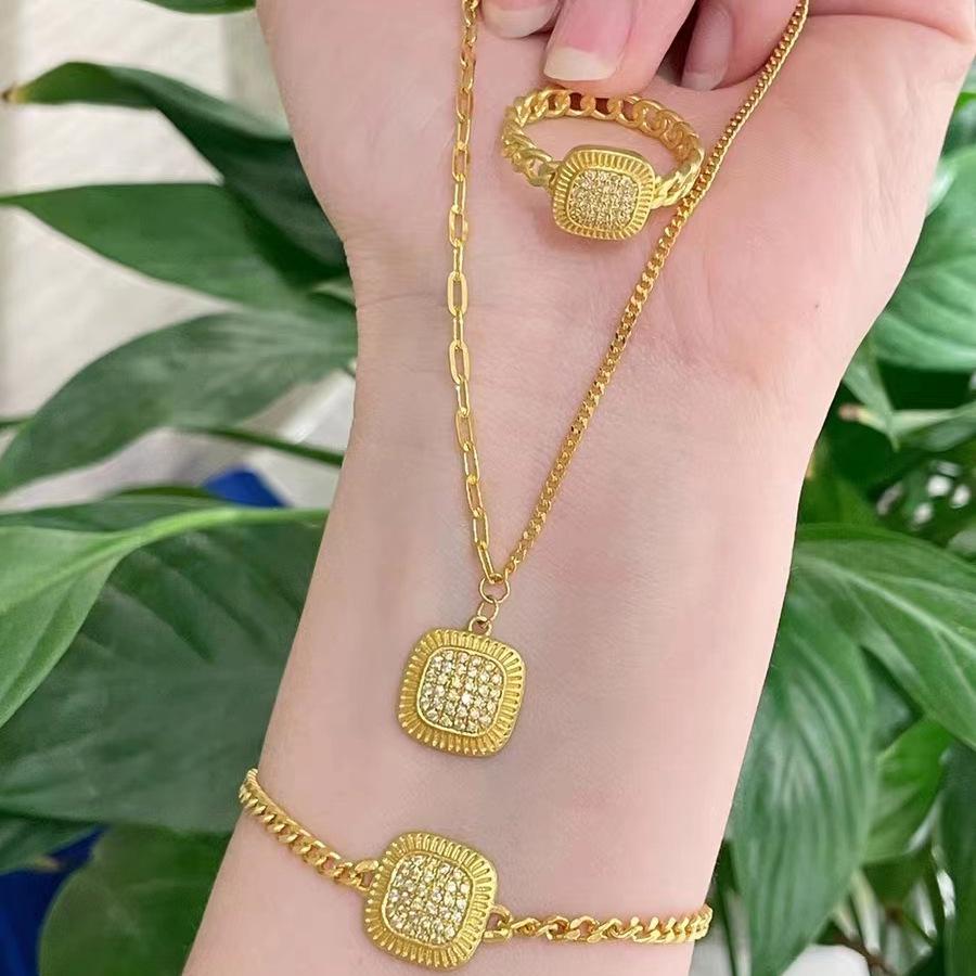 

Gold-Plated Brass Jewelry Set: Vietnamese Sand Gold Necklace, Bracelet, & Ring for Women Emblem Inlaid Gilded Years Adjustable Ring
