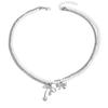 Alloy hollow bow pendant stacked with simple temperament pearl necklace light luxury niche design