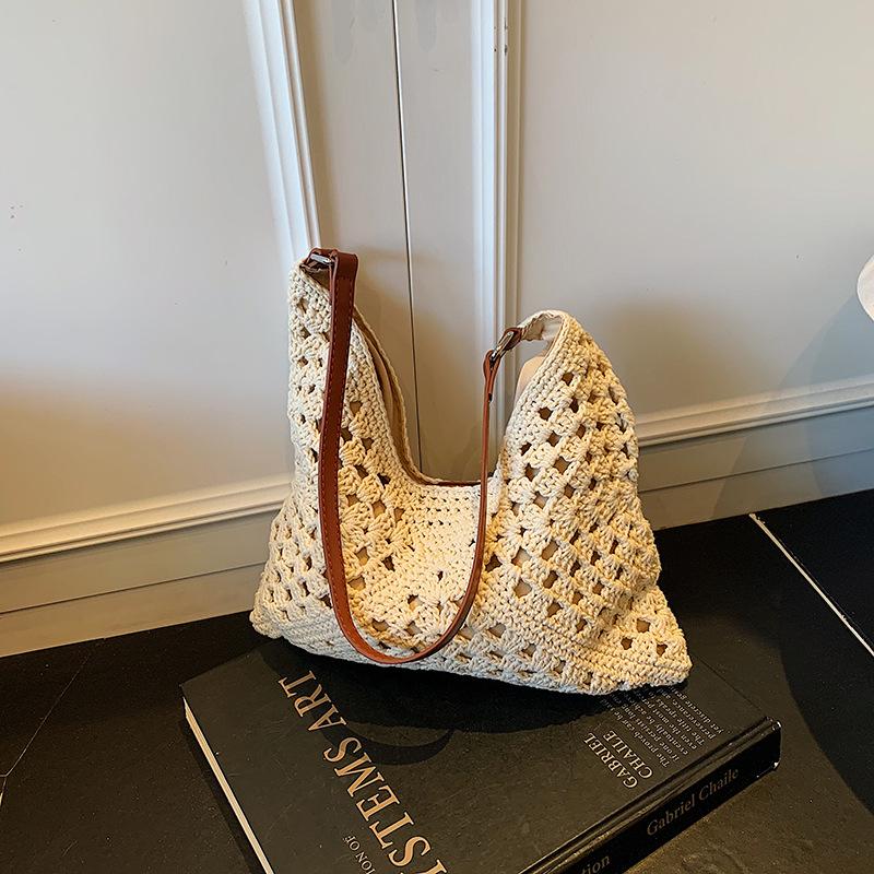 

Нишевая плетеная сумка женская 2025 новая полая вязаная на плечо подмышку сумка-тоут сумка-ведро