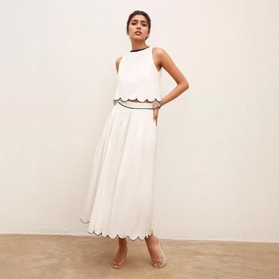 A Women's Stylish Commuter Lace Sleeveless Short Top and Half Skirt Set