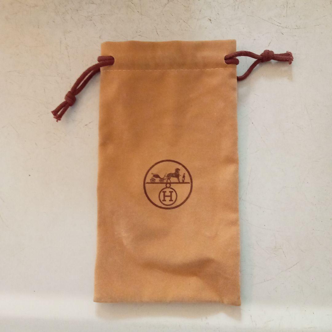 Used Hermes beige suede pouch with watch manual