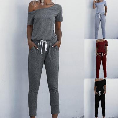 Mono de mujer de color liso con cintura ajustada, disponible en 4 colores. Mono de mujer con hombros oblicuos para ir de compras.