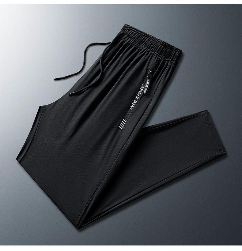 Pantaloni della tuta casual estivi da uomo in seta ghiacciata, sottili e traspiranti, con gamba dritta, tasche con cerniera e polsini.