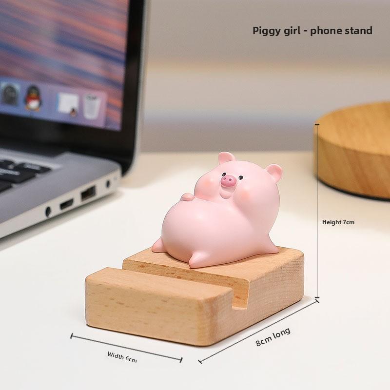 Mobile Phone Stand - Zhenan Zhenan, a Cute Resin Figurine for Home, Living Room, Tabletop Decoration. A Cute Pig-shaped Toy for Luxury Display.