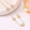 European Three-Piece Jewelry Set: Retro Black Gold Four-Leaf Clover Necklace, Earrings, and Bracelet