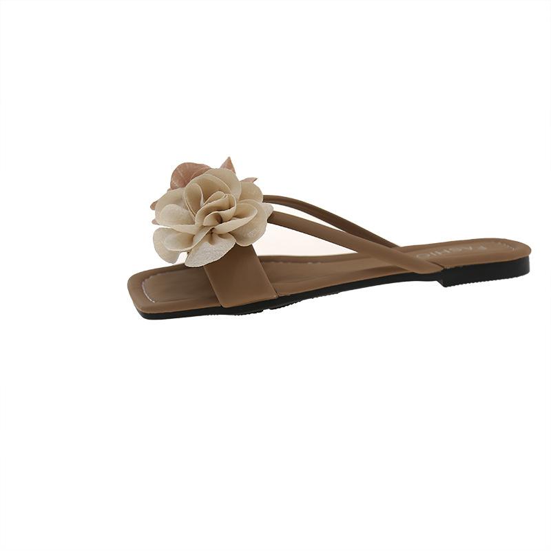 Été porter style fée décontracté pantoufles un mot femme 2025 nouveau tempérament mode fleur fond plat pantoufles cool femme