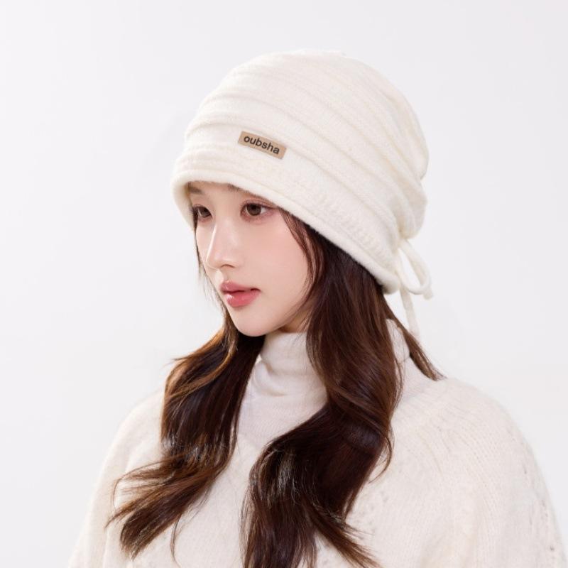 Winter new versatile solid color cloth label strap stacking hat women's thickened warm knitted hat source