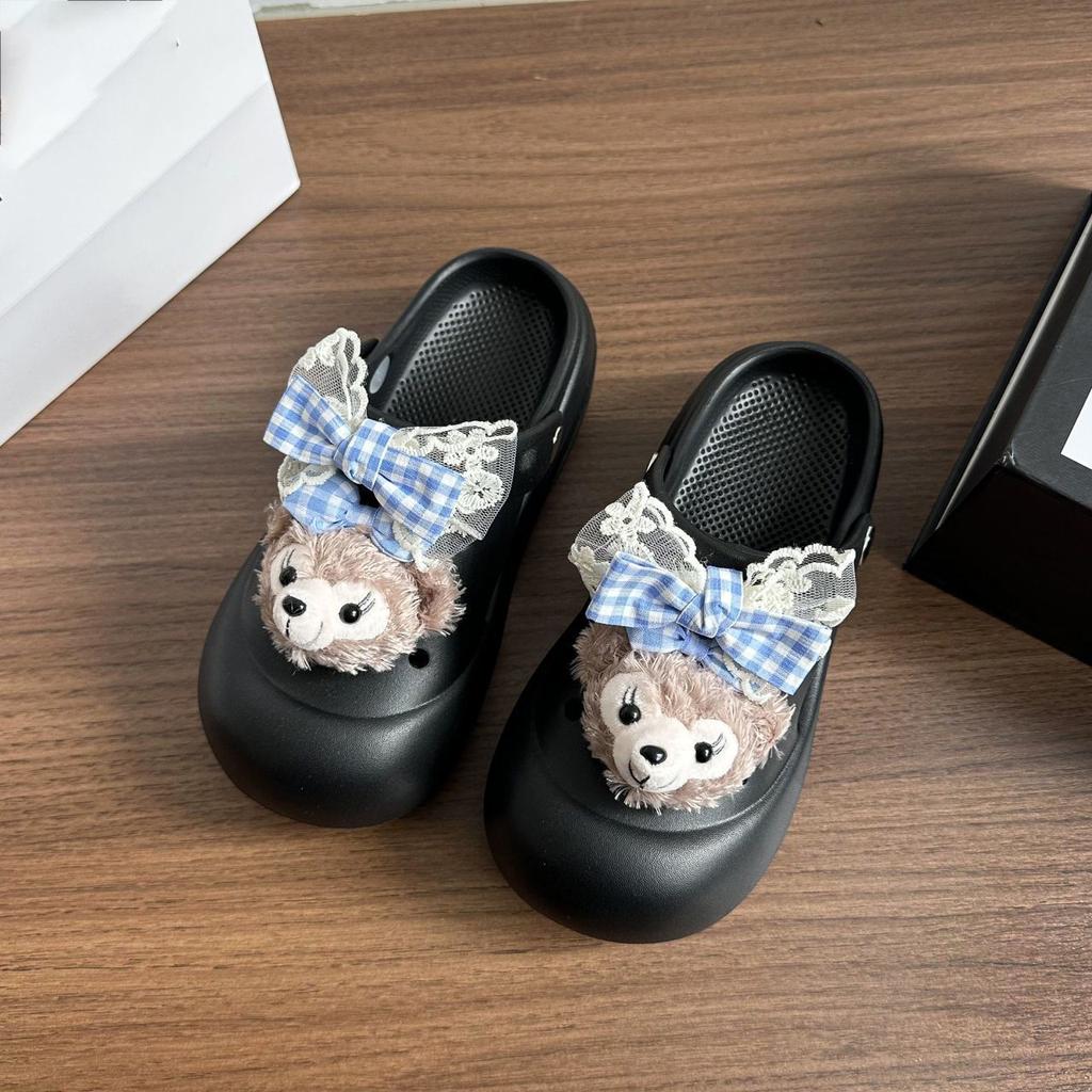 Gruboszelesowe gówno-kroczące torby głowa ciągnąca fajne kapcie słodkie i urocze kreskówkowe kokardki buty z dziurami odzież wierzchnia 2025 lato nowe modele