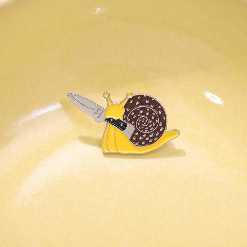 Unique And Creative Snail Shaped Brooch With Knife Design For Stylish Animal Lovers