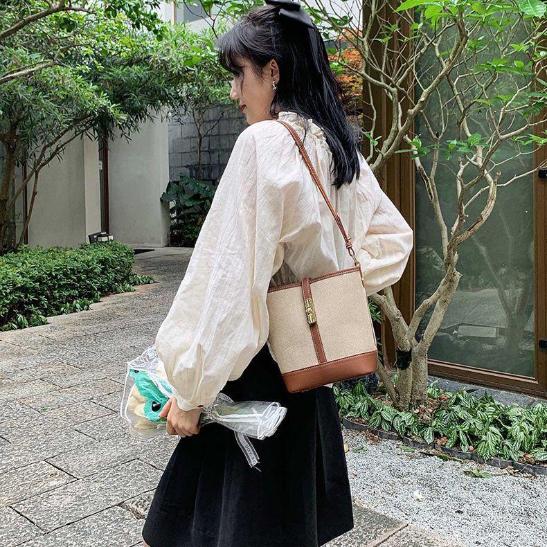 Cowhide canvas splicing bucket bag women's 2025 summer shoulder oblique span bag casual versatile underarm bag Korean version tide