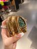 Orologio da donna al quarzo con cinturino in acciaio a due cerchi a forma di serpente, personalità, completamente diamantato, produttore