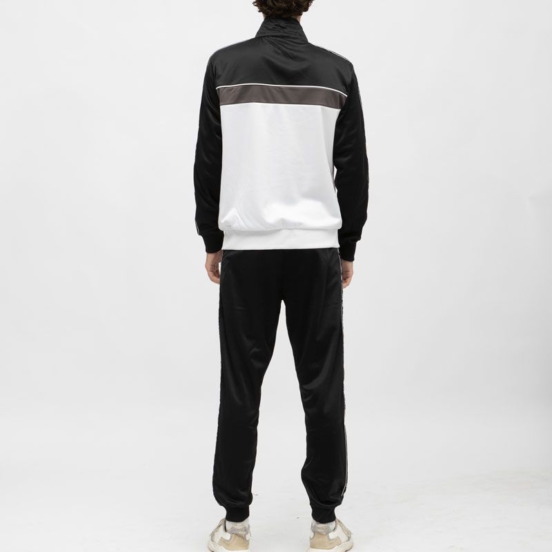 Ensemble jogging noir et veste zippée blanche avec bandes noires Homme ELLESSE