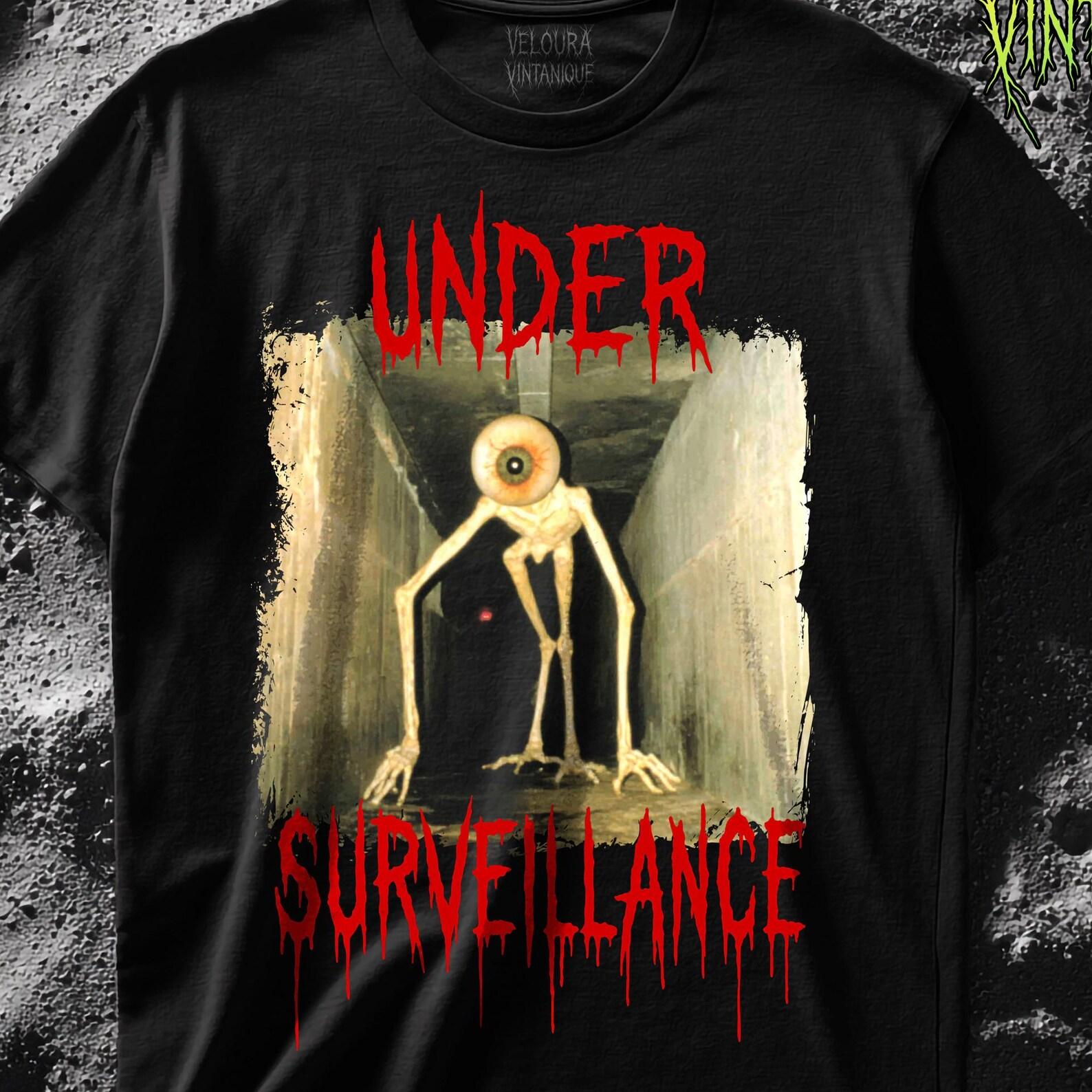 Analog Horror Eye Creature Shirt Creepy Under Surveillance Graphic Tee Scary VHS Aesthetic Monster Design for Horror Fans 3XL