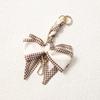 Elegant Hand-Woven Scarf Chain with Bow Decoration Pendant for Bag Strap Modification.