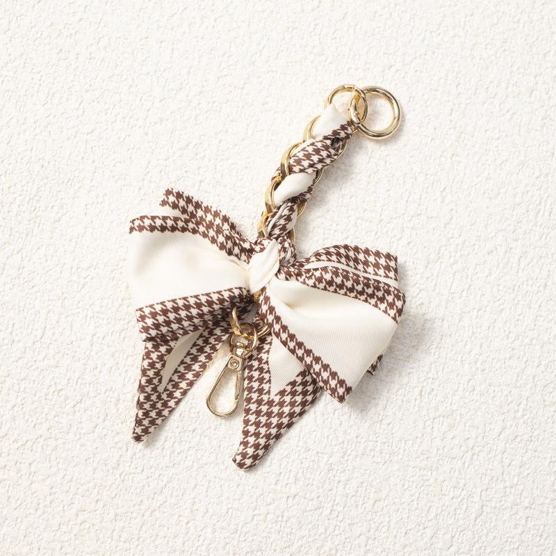Elegant Hand-Woven Scarf Chain with Bow Decoration Pendant for Bag Strap Modification.