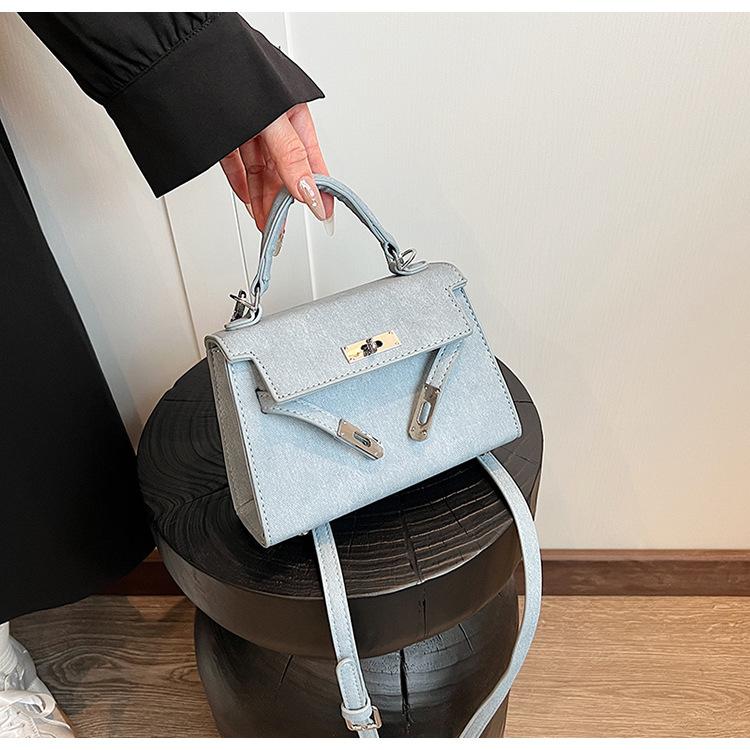 Letošní populární niche ruční taška Kelly Dámská nová retro vysoce kvalitní textura Jednoramenná crossbody taška