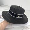 Spring and summer new metal small label decorative flat top straw hat men's and women's top hat sunshade holiday beach hat summer hat