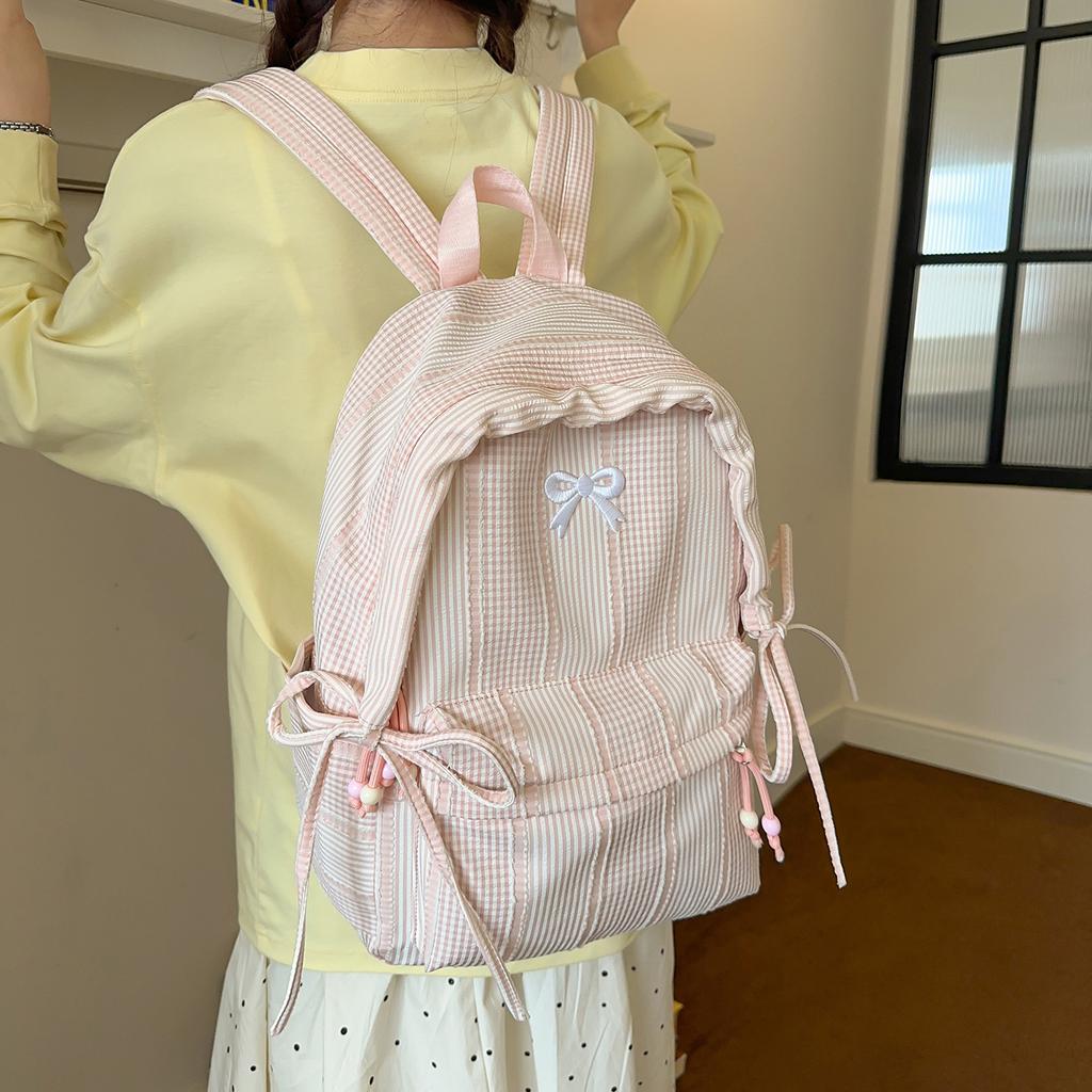 Schoolbag small fresh striped backpack women's 1011 new bow schoolbag students large capacity light travel backpack tide