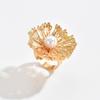 Hollow flower ring European and American niche design sense irregular spiral imitation pearl open ring jewelry women
