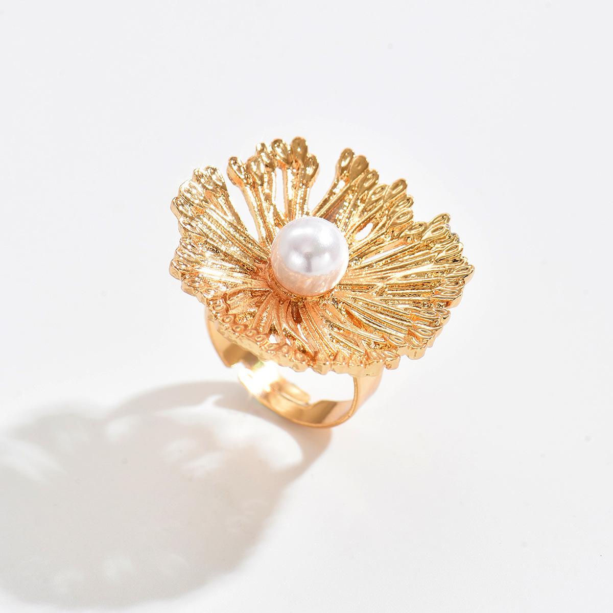 Hollow flower ring wholesale European and American niche design sense irregular spiral imitation pearl open ring jewelry women