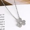 Elegant Women’s Triple Clover Necklace with Full Diamond Petals and Single Diamond, Trendy Versatile Flower Design.