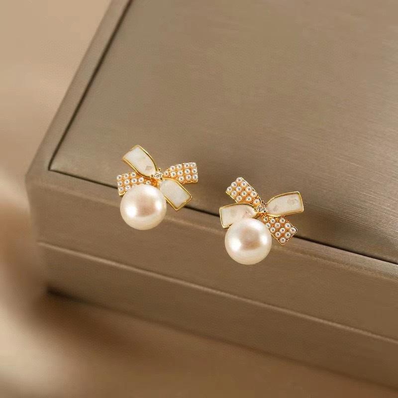 Korean sweet natural freshwater pearl stud earrings ins temperament 911 silver needle bow earrings women's high sense