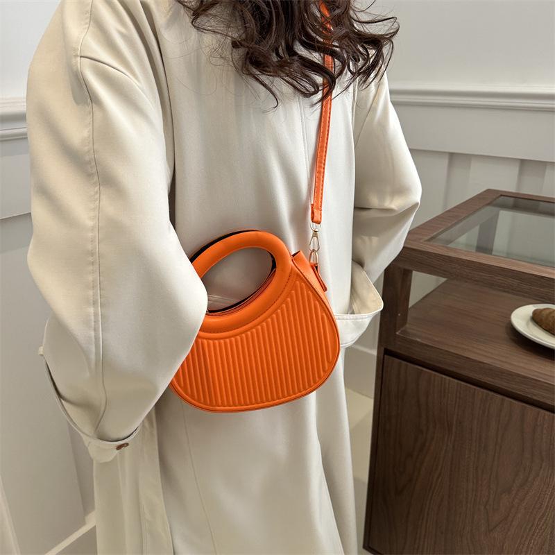 Solid color handbag women's 2025 early new fashion casual messenger bag portable small bag